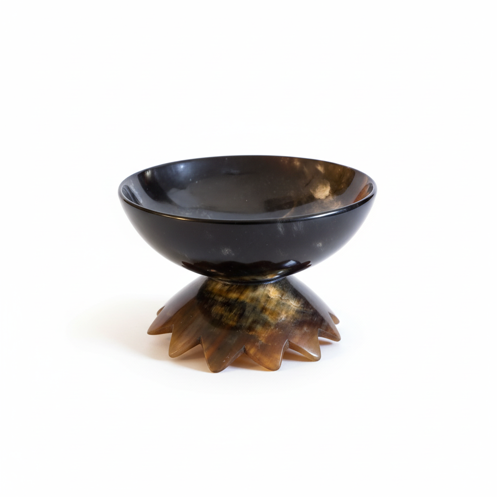Handmade Haitian ox horn footed pedestal bowl with star base on white background