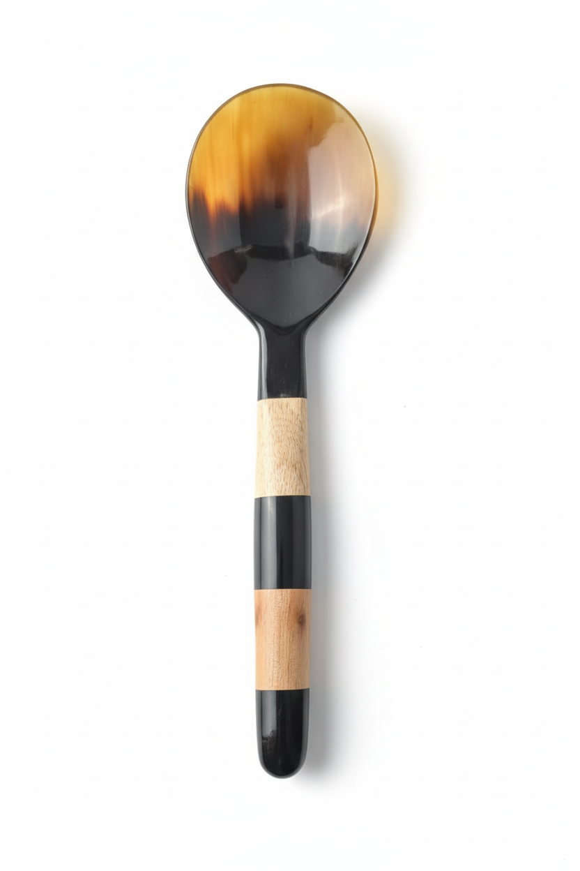 Handmade Haitian black amber horn and striped wood salad serving spoon on white background