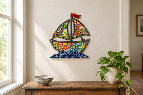 Daisy Boat recycled steel drum wall art above an entryway console