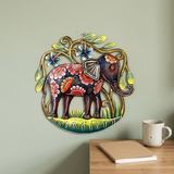 Handmade Haitian steel drum elephant wall art beside a wooden office desk