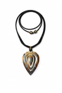 Handmade Haitian ox horn teardrop pendant necklace with concentric carved design on black leather cord white background