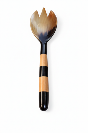 Handmade Haitian amber horn and striped wood salad fork on white background
