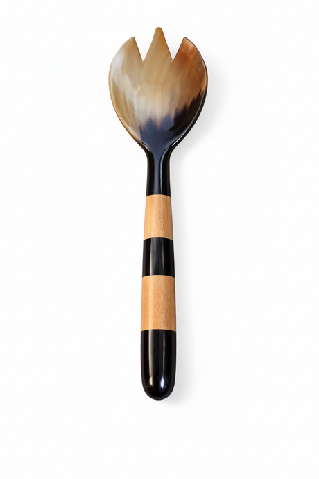 Handmade Haitian amber horn and striped wood salad fork on white background