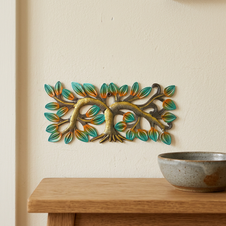 Tiny Haitian metal tree wall art above an oak entryway console