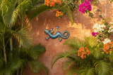 Blue metal gecko wall art on tropical outdoor patio wall