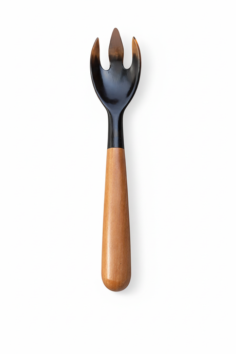 Handmade Haitian black ox horn and teak wood cocktail fork on white background