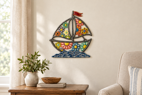 Daisy Boat painted Haitian metal wall art above a living room side table