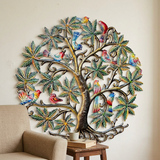 Recycled metal Birds Tree of Life wall art beside a reading chair.