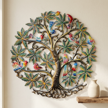 Hand-hammered trunk, colorful birds, and green foliage in Haitian Tree of Life metal wall art.