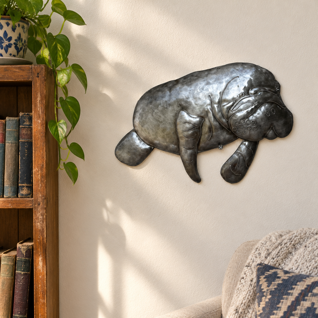 Haitian recycled steel manatee wall art in a reading nook