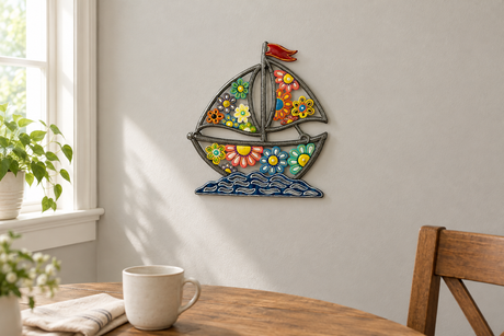 Painted floral sailboat metal wall art in a casual dining nook