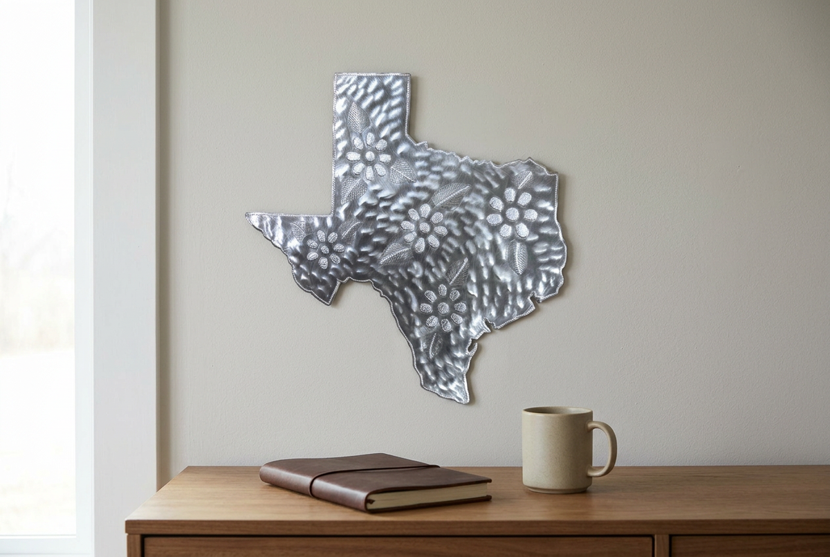 Silver-toned Texas floral steel drum wall art above a home office desk