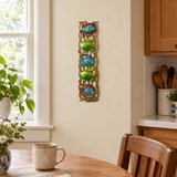 Handpainted Haitian stacked tropical fish metal wall art in a kitchen breakfast nook