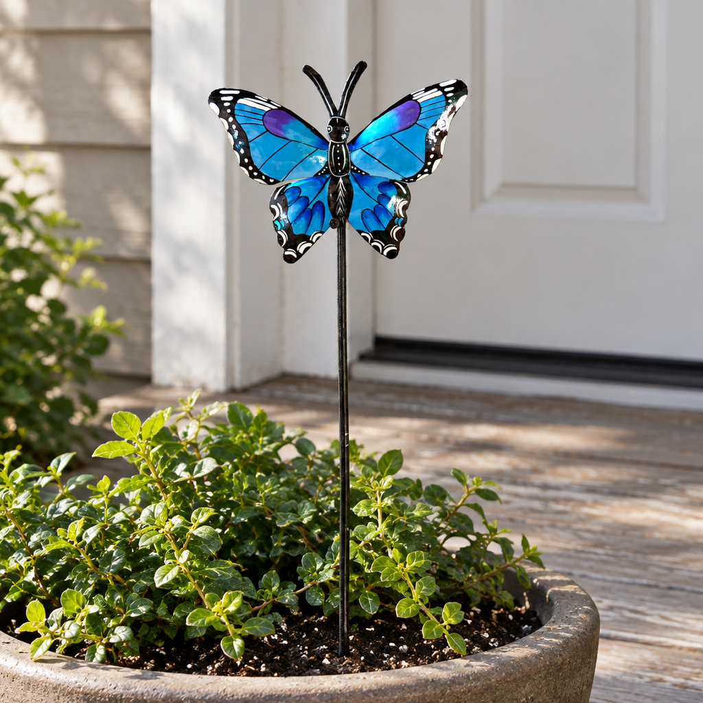 Blue and purple Haitian metal butterfly garden stake in a porch planter