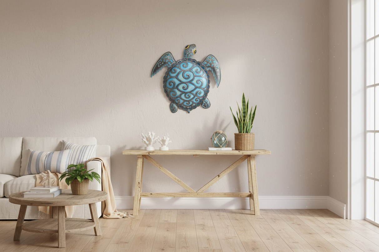 Blue metal turtle wall art displayed in modern coastal living room with natural light and beach-inspired decor