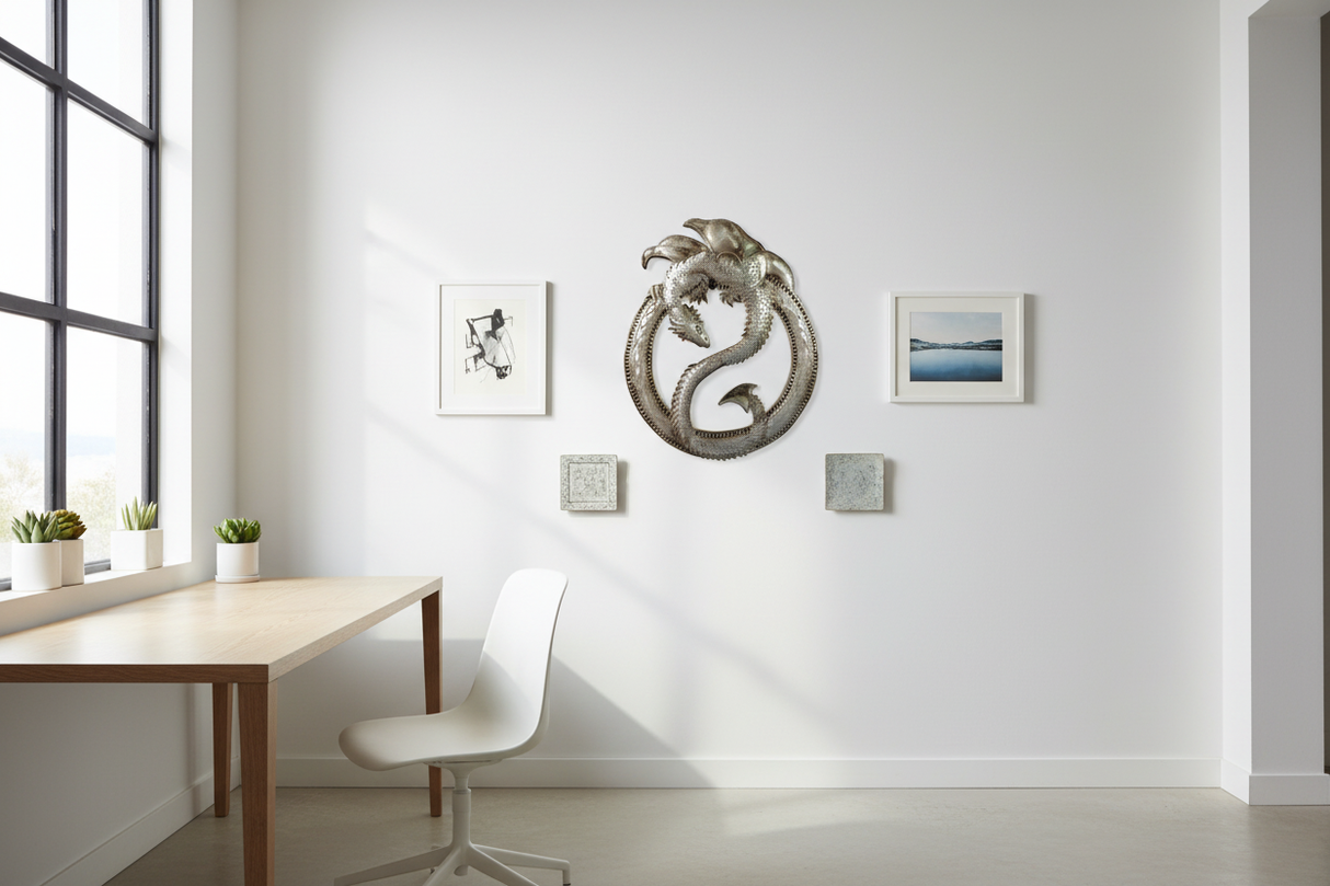Haitian dragon metal wall art as centerpiece on a white gallery wall in a modern minimalist home office