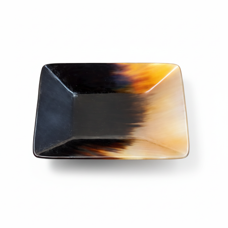 Handmade Haitian black and amber sunset square ox horn bowl on white background