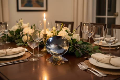 Haitian horn footed pedestal bowl as luxury dining table centerpiece with flowers and candlelight