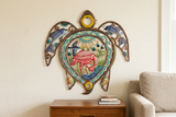 Painted Oil Drum Top Turtle metal wall art above a living room side table