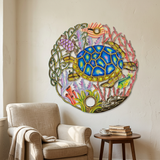 Handmade Haitian ocean turtle wall art beside a reading chair.