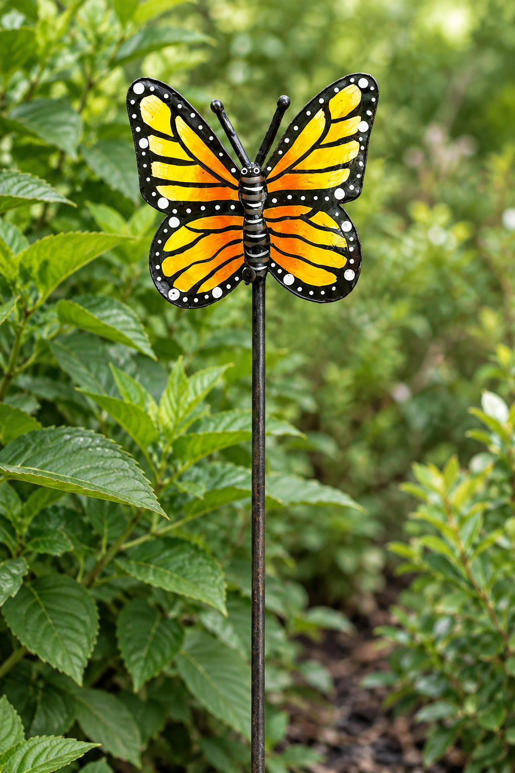 Close-up of the yellow and orange painted wings on the Espwa butterfly garden stake