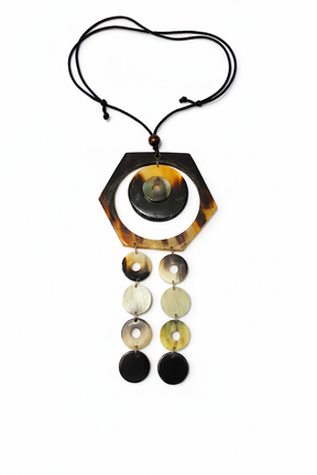 Handmade Haitian ox horn hexagon frame with grey dome disc and two graduated disc cascade strands on white background