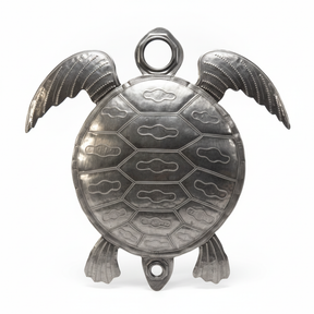 Handcrafted Haitian metal sea turtle sculpture with detailed shell pattern and textured flippers in natural steel finish