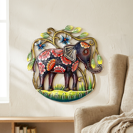 Small floral elephant metal wall art beside a linen living room armchair