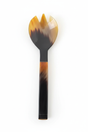 Handmade Haitian all-horn large salad serving fork with amber to black square handle on white background