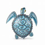 Blue metal turtle wall art with intricate spiral shell patterns handcrafted in Haiti