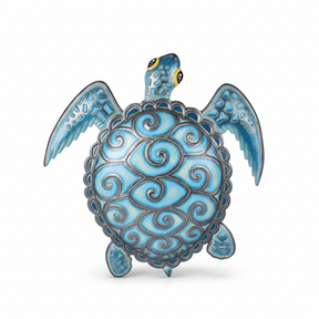 Blue metal turtle wall art with intricate spiral shell patterns handcrafted in Haiti