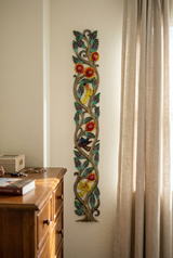 29-inch tall tree metal wall art beside a bedroom dresser.